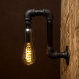 Black industrial iron pipe wall light